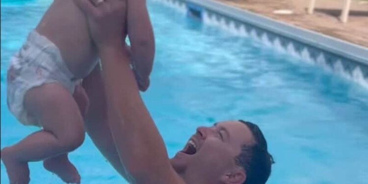 Scotty McCreery Shares Adorable Video Swimming With His 10-Month-Old Son Avery And Dog Moose