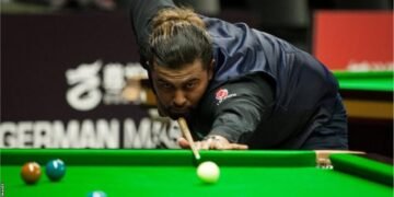 British Open: Hammad Miah shocks former world champion Judd Trump to reach third round in Cheltenham
