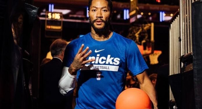 Derrick Rose playing chess at Drake’s concert