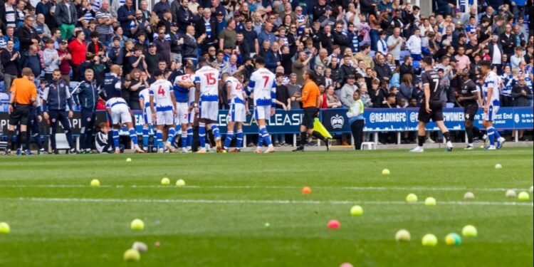 Match SUSPENDED as furious fans launch tennis balls onto the pitch in bitter protest