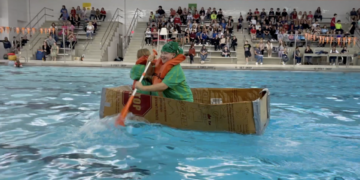 Akron Middle School students sail on the swimming pool