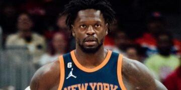 Mason Plumlee carried off court after collision with Julius Randle