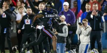 Kansas football star Devin Neal continues to weigh his future options