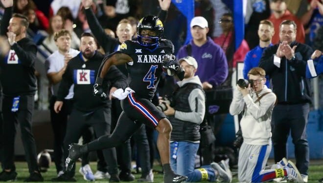 Kansas football star Devin Neal continues to weigh his future options