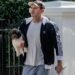 Chelsea legend Frank Lampard carries adorable puppy while out for a walk near his London home
