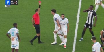 Premier League cult villain Neal Maupay laughs are being sent off for Marseille with two bookings in three minutes